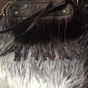 Wilson’s leather tootsie roll fringe purse